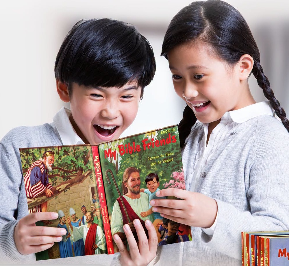 Two children reading Book 10 of My Bible Friends together